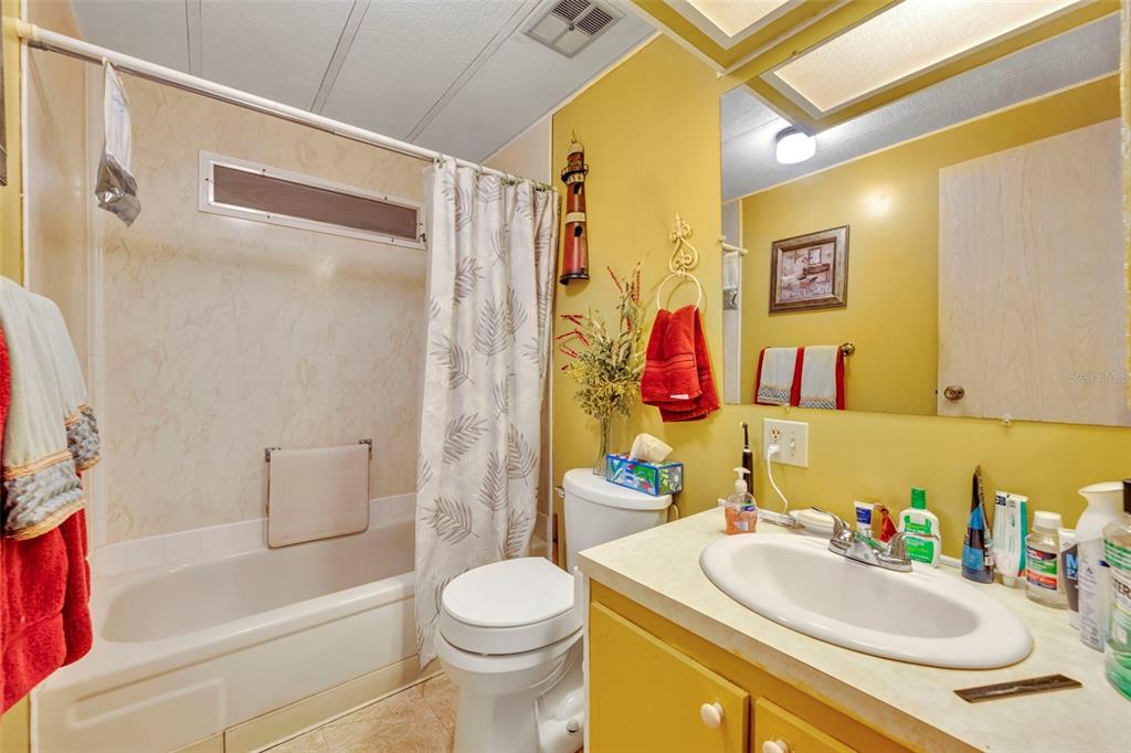 223 Paradise Leesburg, FL 34788 - Photo 19 of 43 a bathroom with a sink toilet and shower