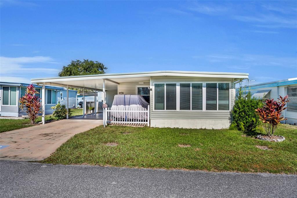 223 Paradise Leesburg, FL 34788 - Photo 2 of 43 front view of a house with a yard