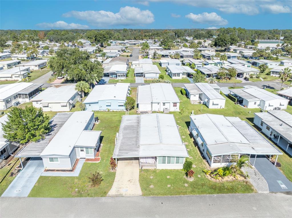 223 Paradise Leesburg, FL 34788 - Photo 24 of 43 an aerial view of residential houses with outdoor space and street view