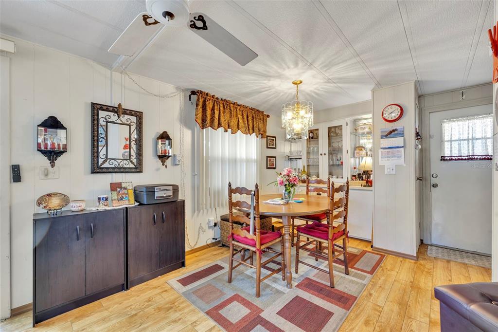 223 Paradise Leesburg, FL 34788 - Photo 10 of 43 a dining room with furniture and window