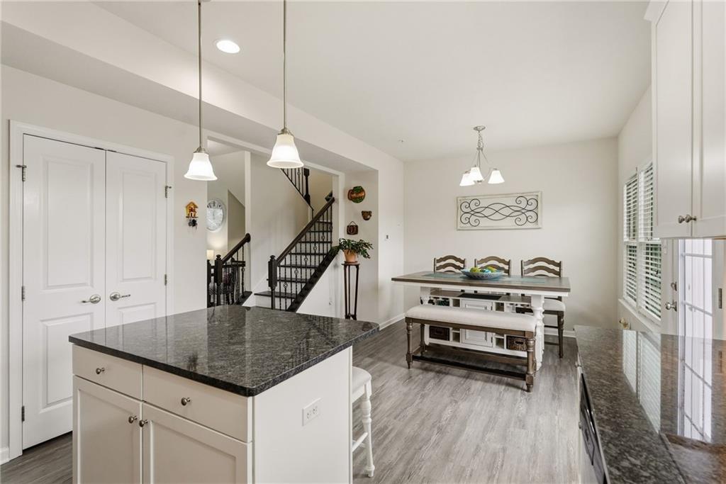 103 John Street Washington, PA 15301 - Photo 19 of 39 a kitchen that has a table chairs in it and wooden floors
