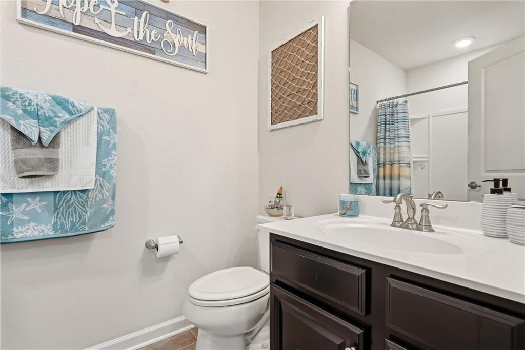 103 John Street Washington, PA 15301 - Photo 27 of 39 a bathroom with a sink a toilet and mirror