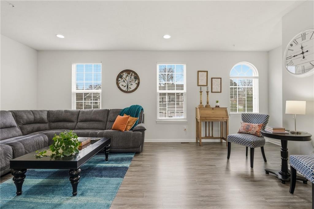 103 John Street Washington, PA 15301 - Photo 5 of 39 a living room with furniture a clock on wall and a window