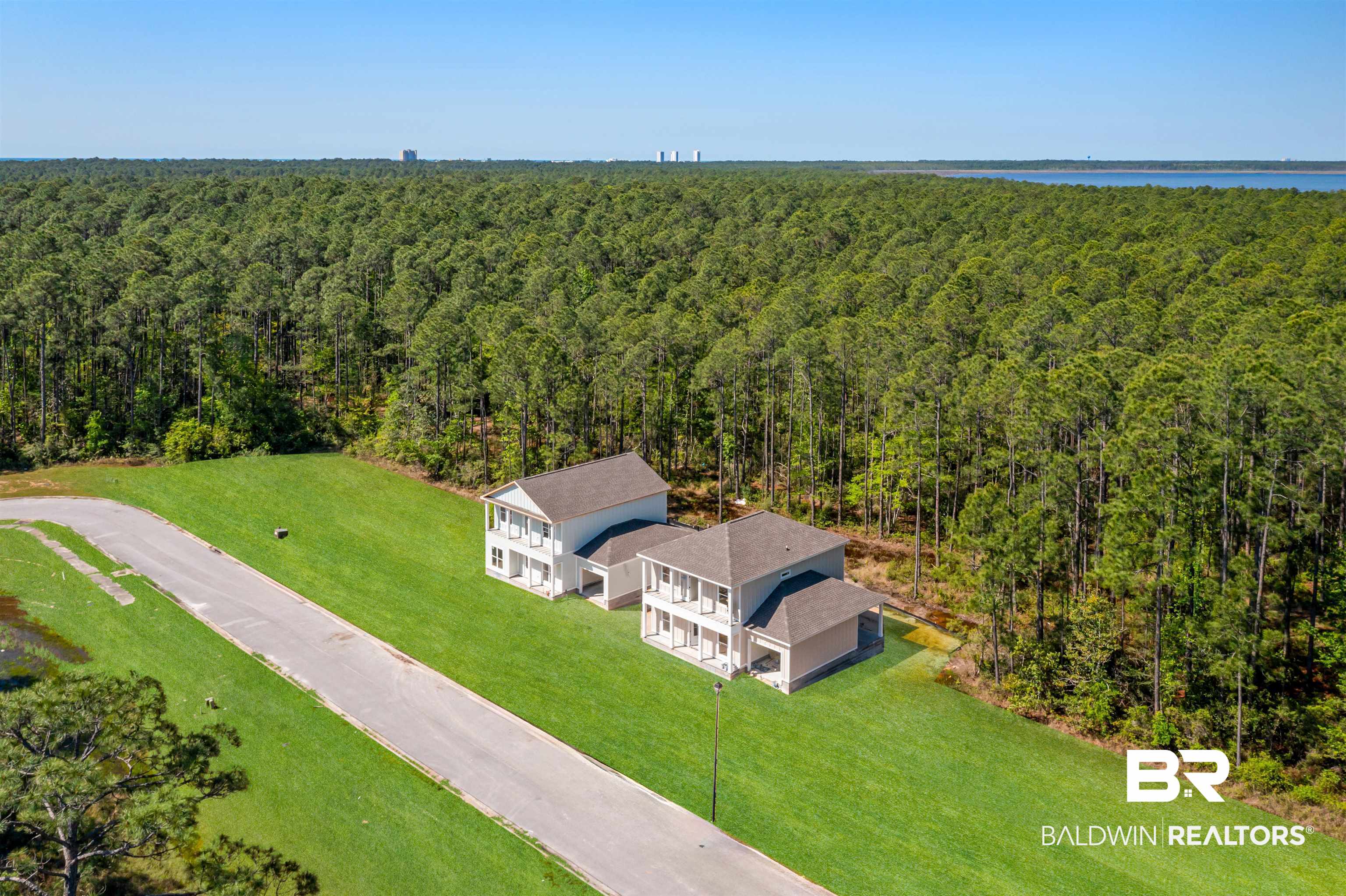 657 Island Way Gulf Shores, AL 36542 - Photo 38 of 59 Birds eye view of property featuring a forest view