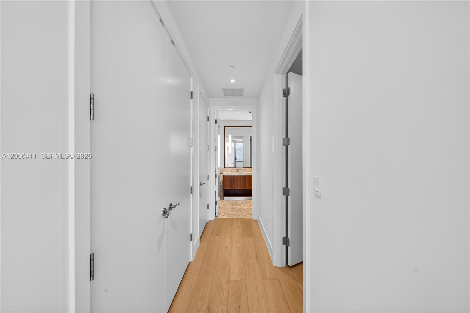175 Southeast 25th Road, Unit 1202 Miami, FL 33129 - Photo 21 of 74 a view of a hallway with wooden shelves
