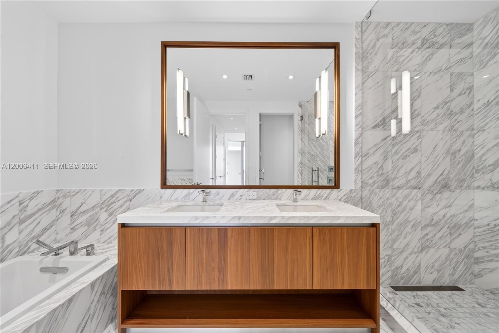 175 Southeast 25th Road, Unit 1202 Miami, FL 33129 - Photo 28 of 74 a bathroom with a sink and a mirror