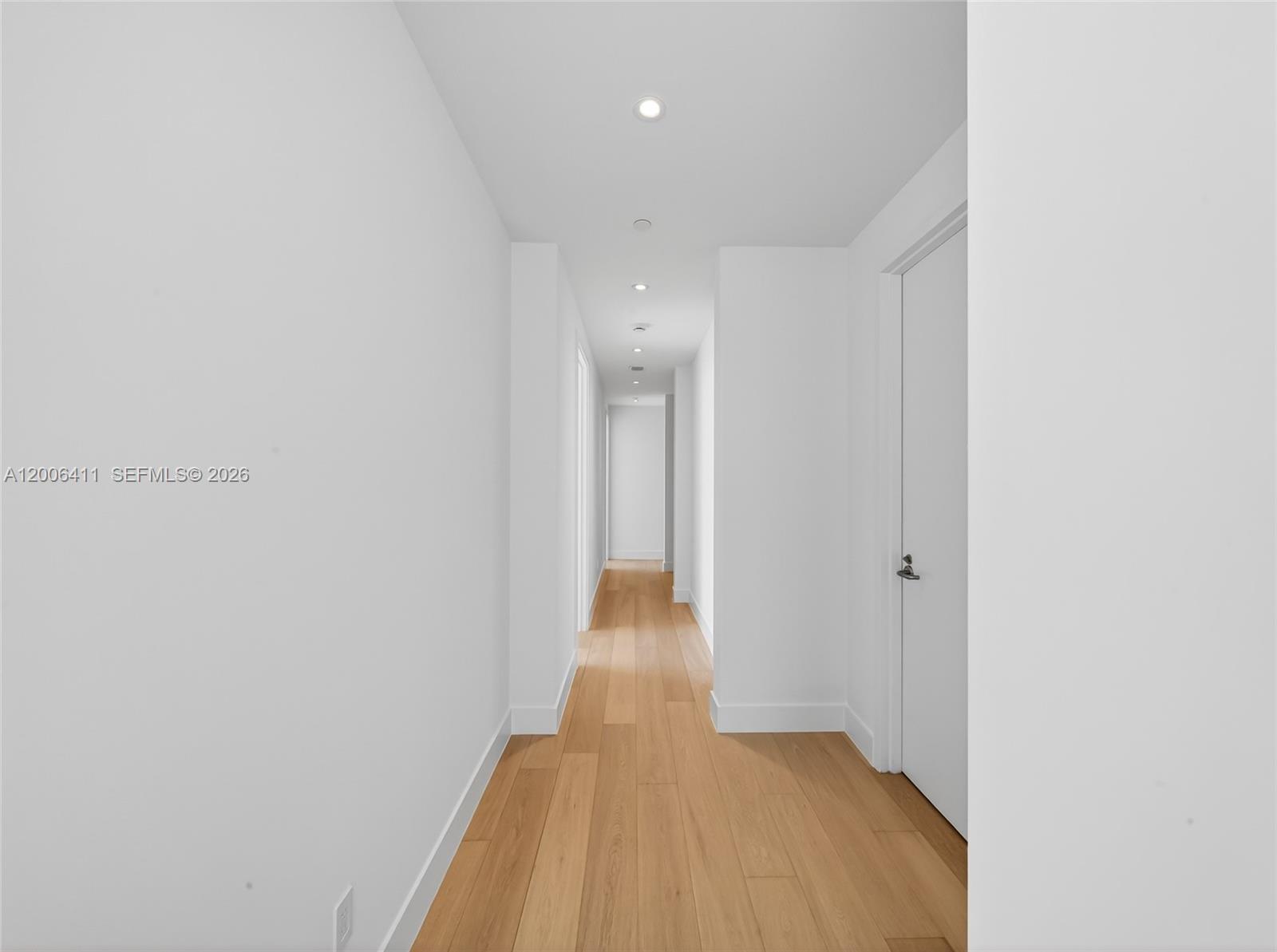 175 Southeast 25th Road, Unit 1202 Miami, FL 33129 - Photo 29 of 74 a view of a hallway with wooden floor