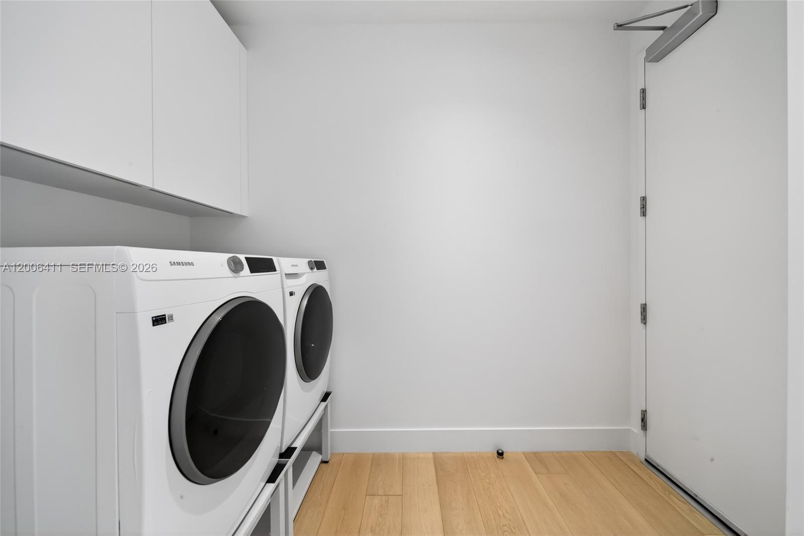 175 Southeast 25th Road, Unit 1202 Miami, FL 33129 - Photo 33 of 74 a utility room with dryer and washer