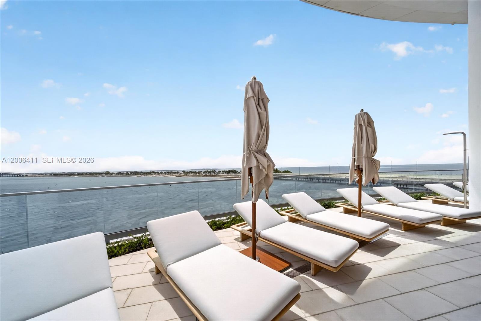 175 Southeast 25th Road, Unit 1202 Miami, FL 33129 - Photo 52 of 74 a view of roof deck with seating space and ocean view