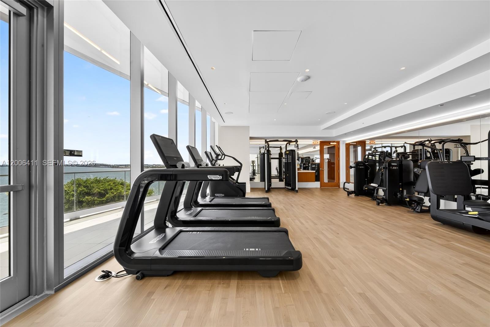 175 Southeast 25th Road, Unit 1202 Miami, FL 33129 - Photo 60 of 74 a view of a room with gym equipment