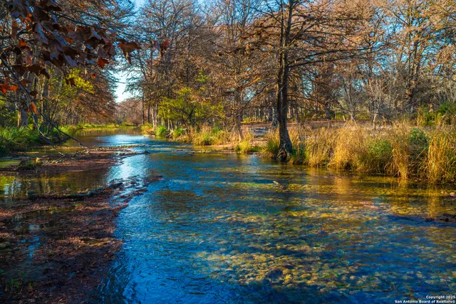 a view of swimming pool with a yard and sitting area