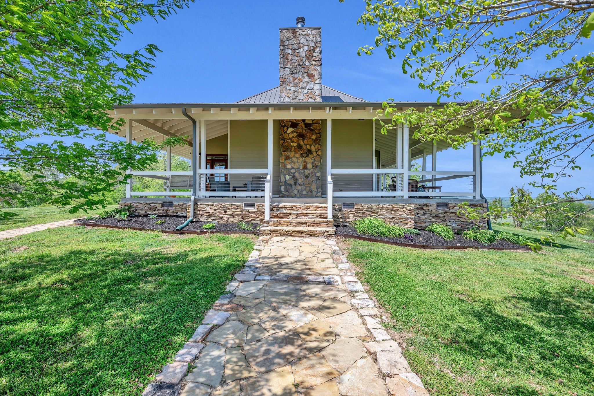 39 Fayetteville Road Kelso, TN 37348 - Photo 5 of 75 a front view of a house with garden
