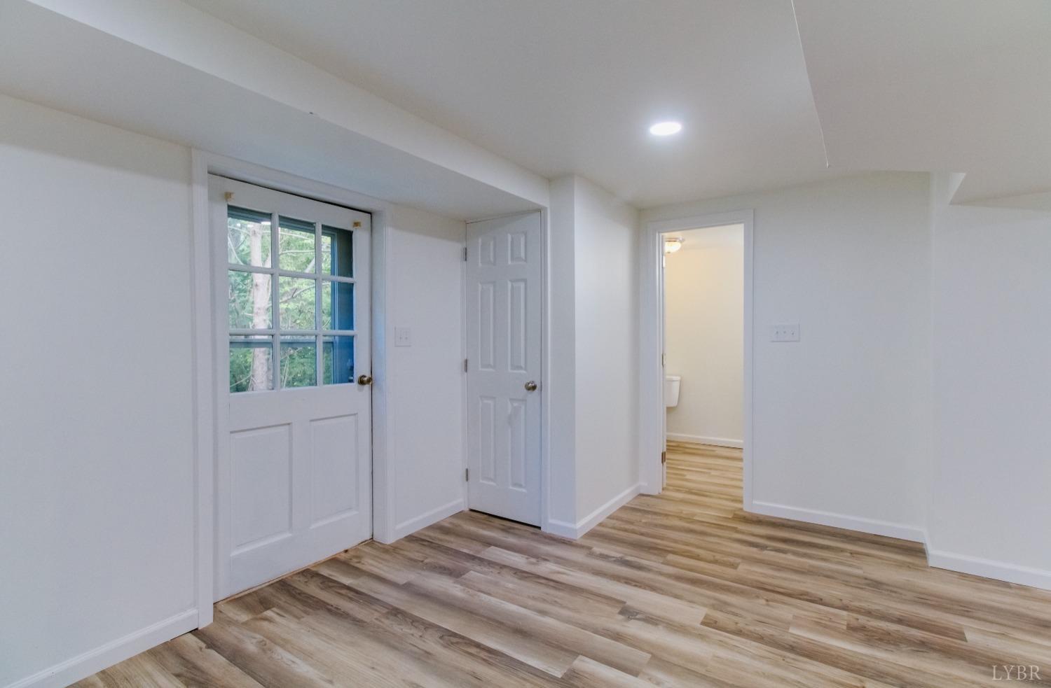 152 Hanger Road Amherst, VA 24521 - Photo 20 of 27 a view of wooden floor and windows in a room
