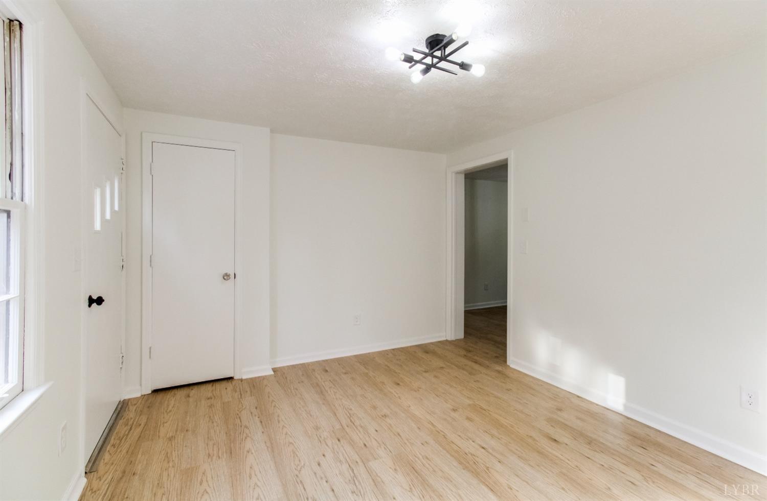 152 Hanger Road Amherst, VA 24521 - Photo 4 of 27 a view of room with a ceiling fan and window