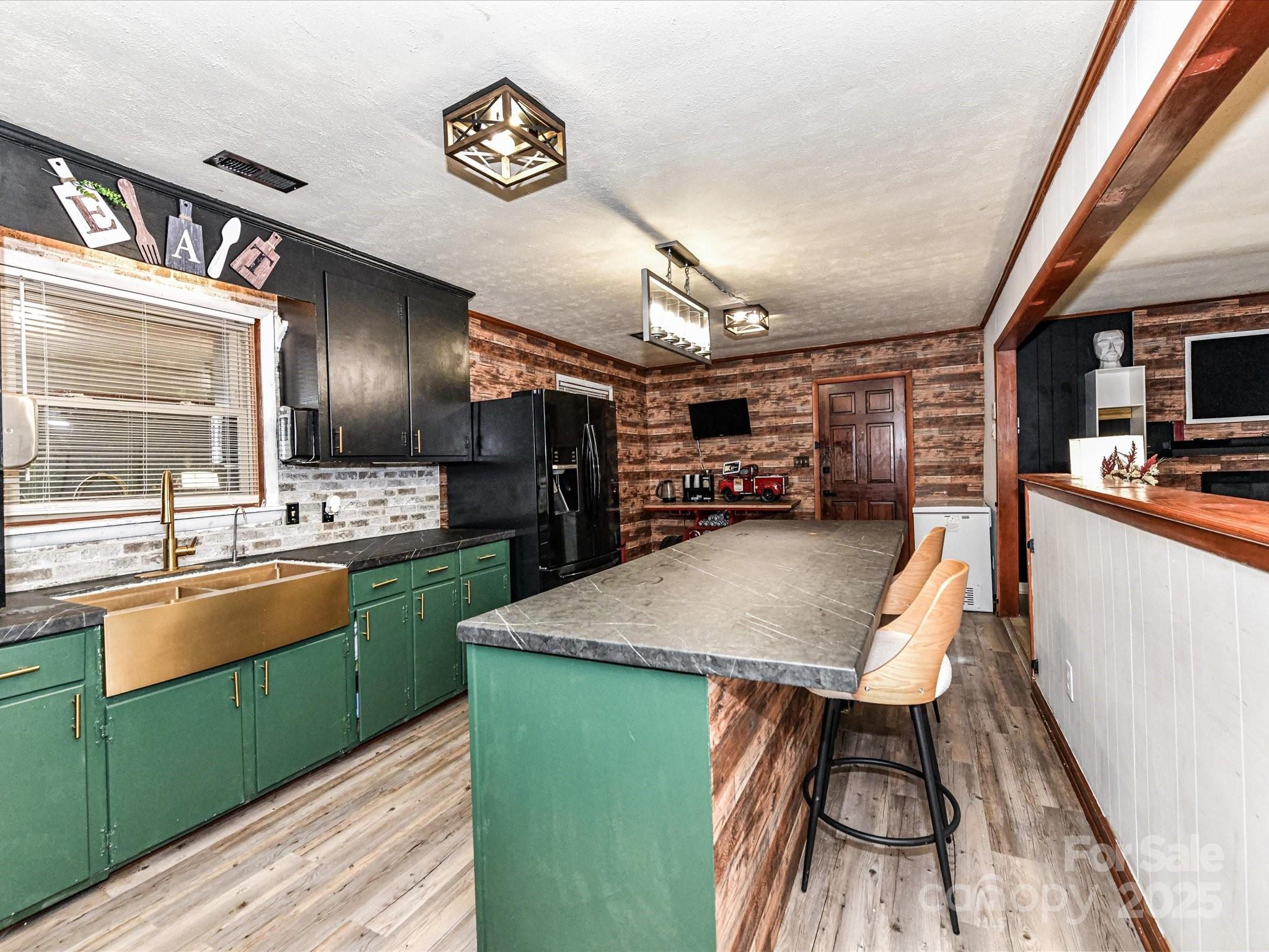 4500 Matthews-Mint Hill Road Matthews, NC 28105 - Photo 13 of 40 a kitchen with stainless steel appliances granite countertop a sink window and cabinets