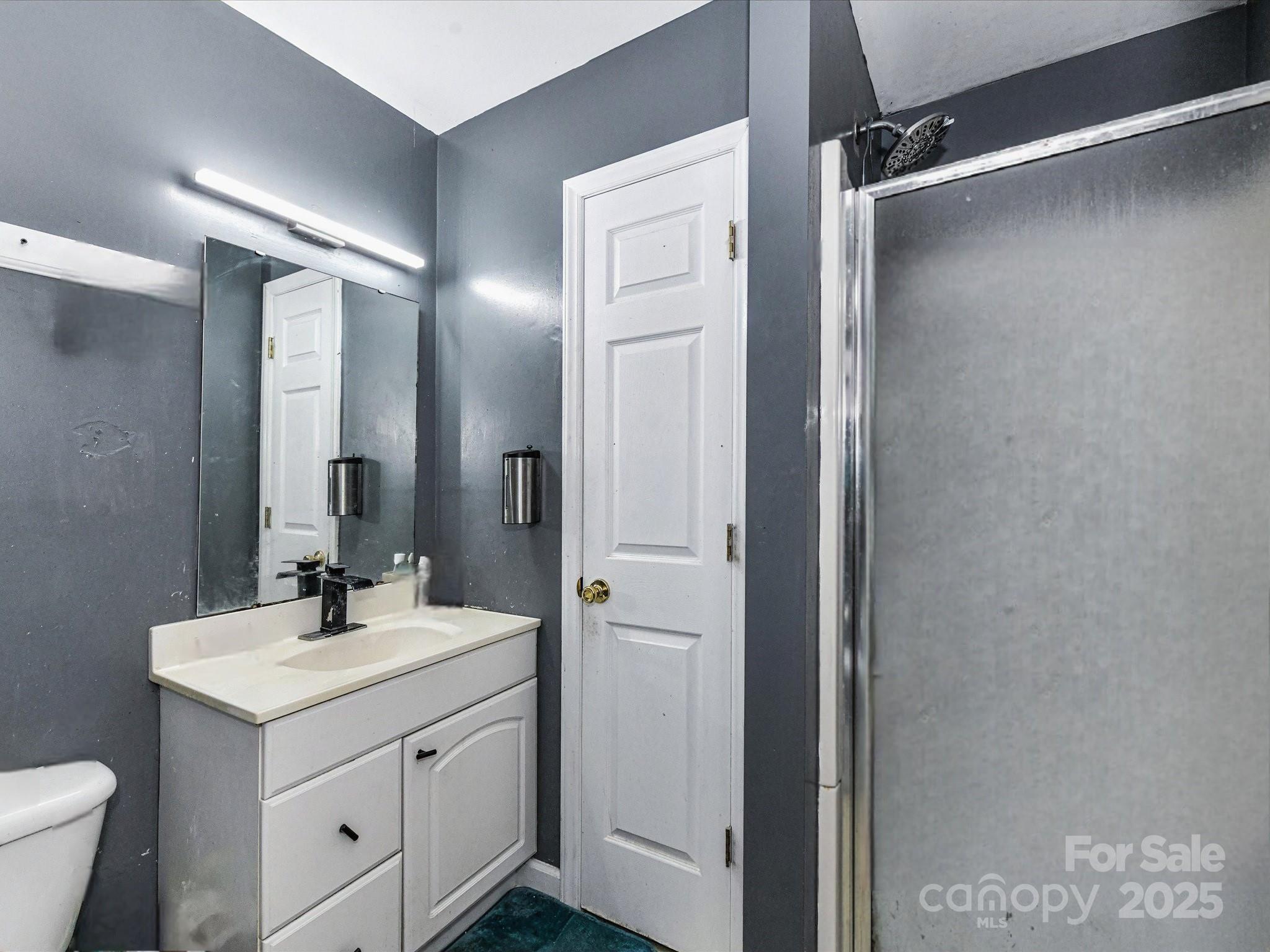 4500 Matthews-Mint Hill Road Matthews, NC 28105 - Photo 20 of 40 a bathroom with a sink toilet and shower