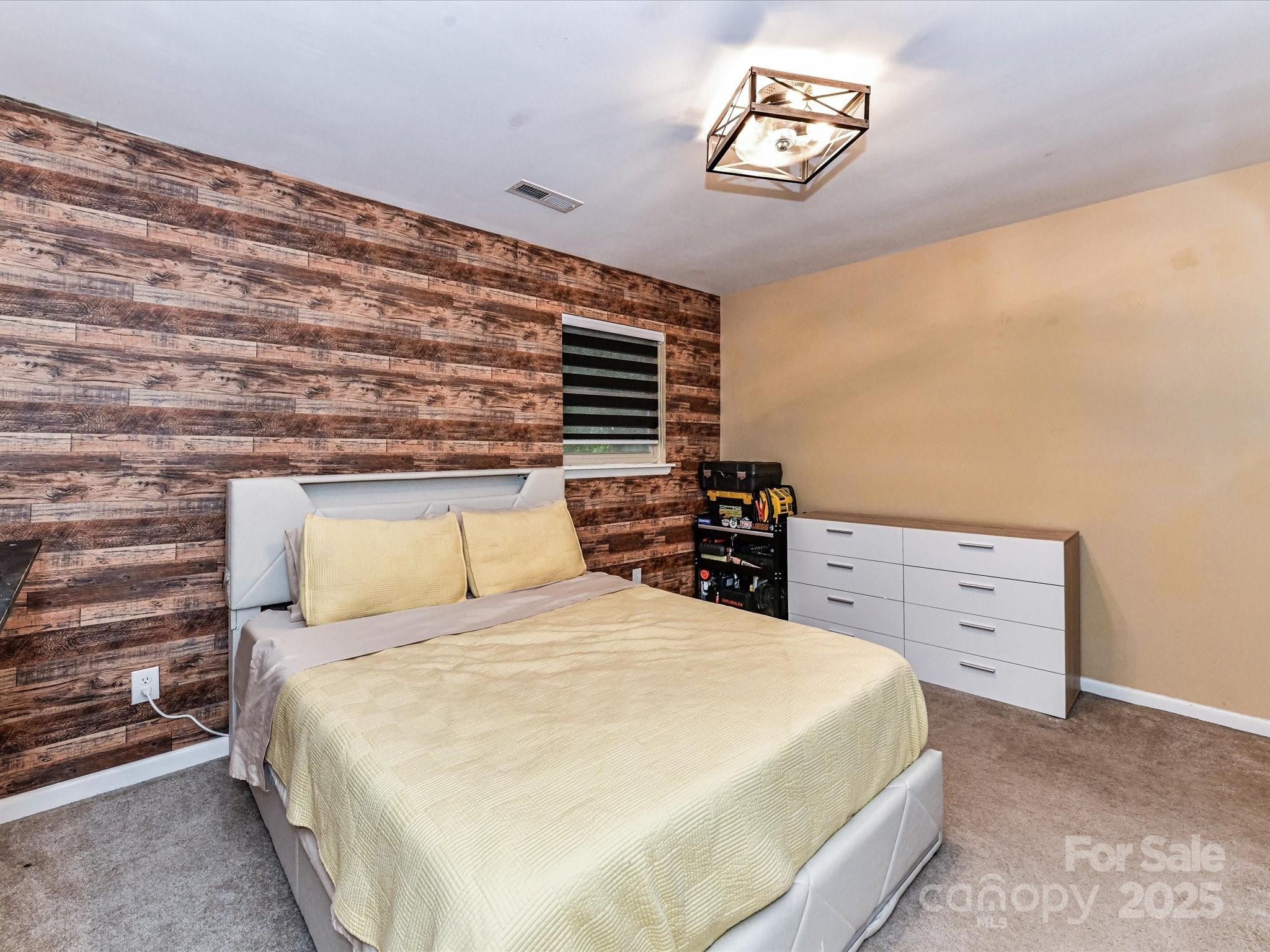 4500 Matthews-Mint Hill Road Matthews, NC 28105 - Photo 22 of 40 a bedroom with a bed and a window