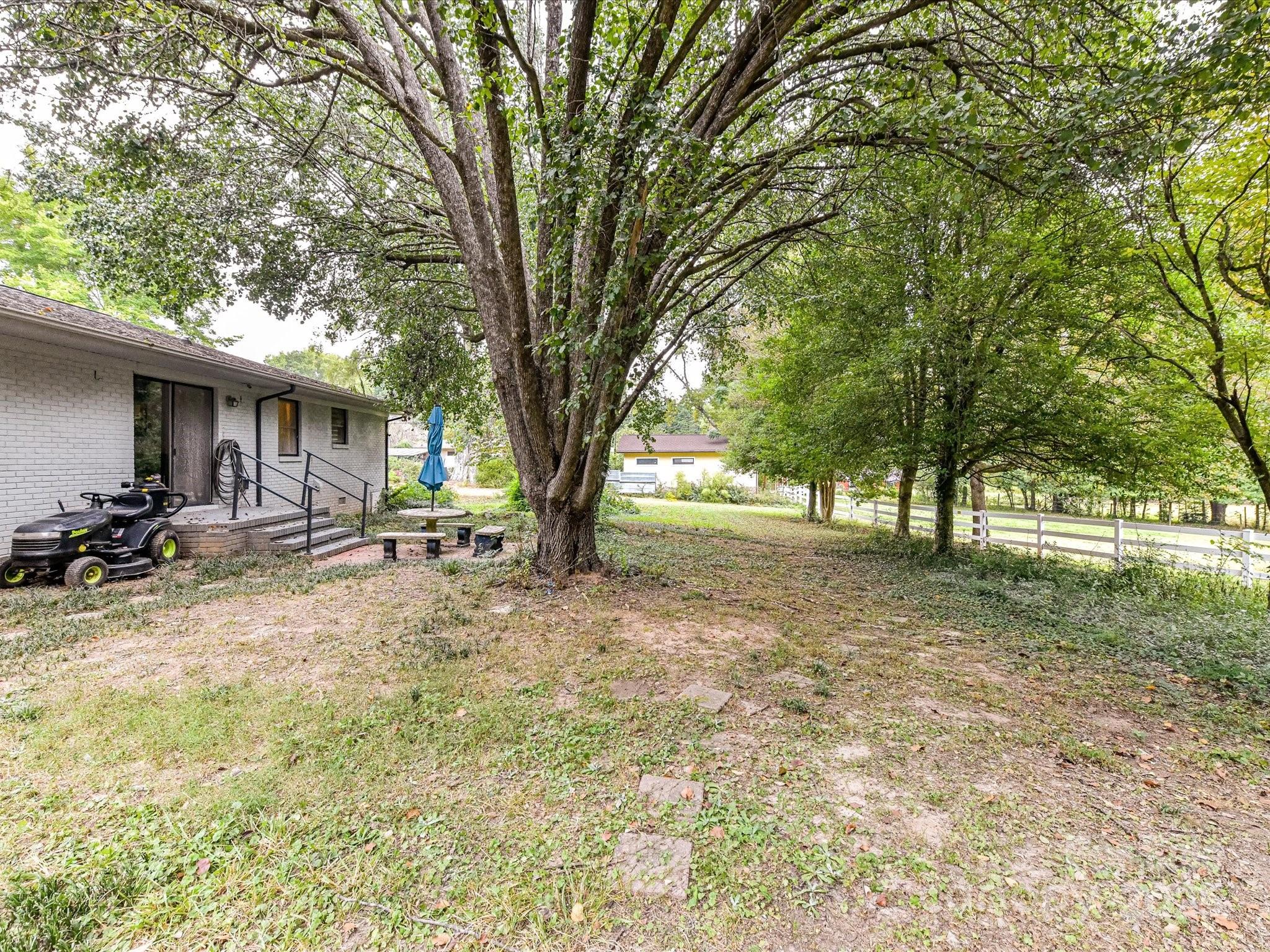 4500 Matthews-Mint Hill Road Matthews, NC 28105 - Photo 32 of 40 a view of a yard with a tree