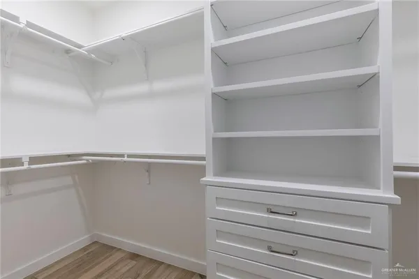 a view of an empty walk in closet