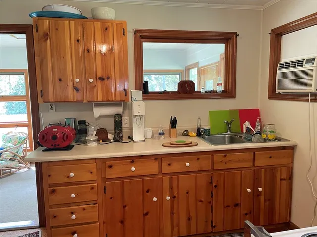 a living room with furniture and a lamp