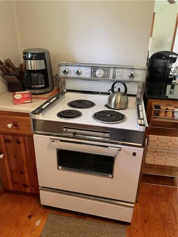 a kitchen with a refrigerator and a sink
