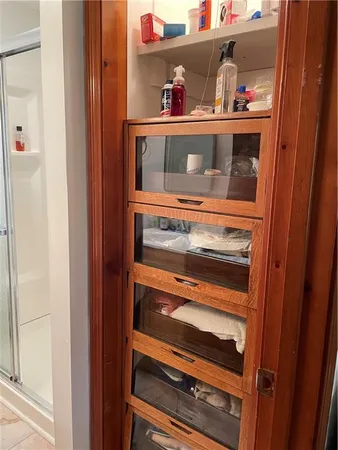 a bathroom with a shower and a mirror