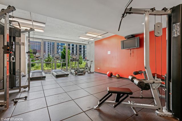 a backyard of a house with yard table and chairs