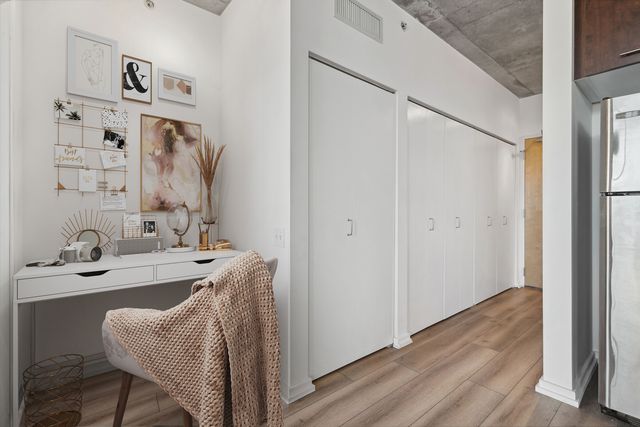 a dining room with furniture and wooden floor