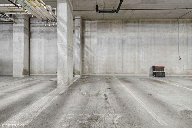 a view of a room with a wooden door