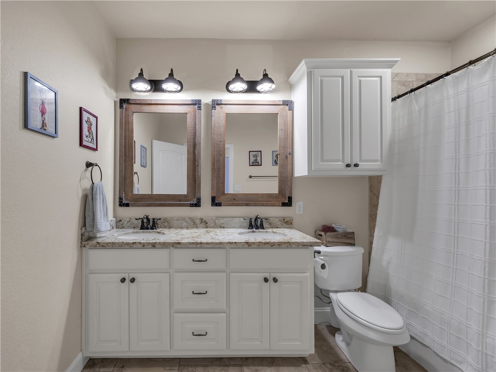 8312 Raintree Drive College Station, TX 77845 - Photo 21 of 30 Dual vanities with stone countertops and undermount sinks