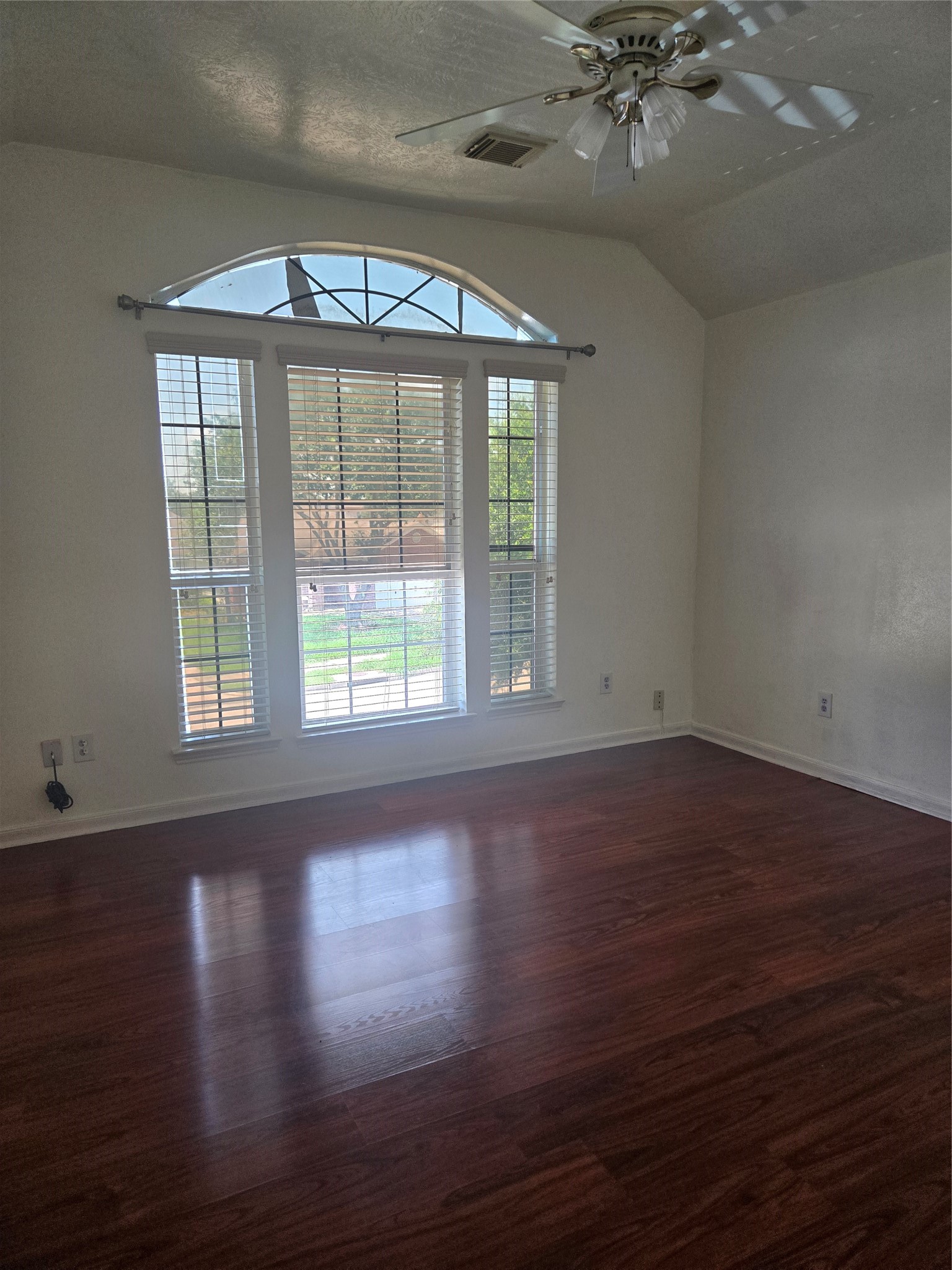 3818 Ridge Canyon Road Baytown, TX 77521 - Photo 10 of 32 a view of an empty room with wooden floor and a window