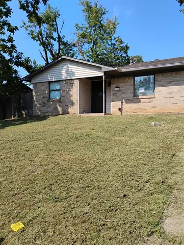 a front view of a house with yard