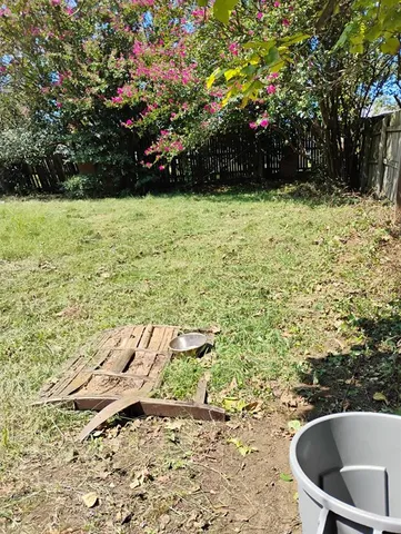 a view of swimming pool with a yard