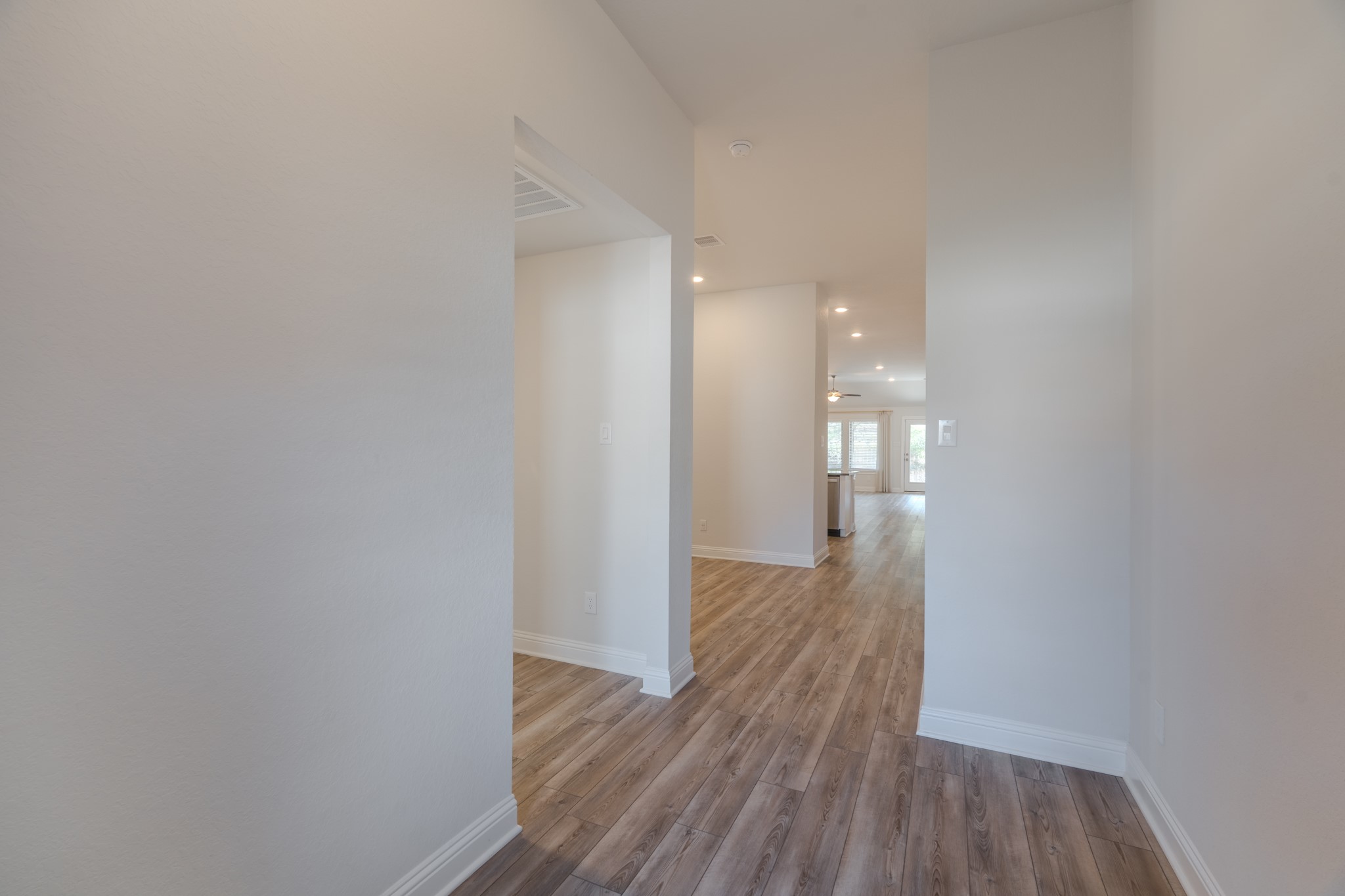 9840 Sweet Flag Court Conroe, TX 77385 - Photo 9 of 50 Step inside to an open-concept layout designed for everyday living and entertaining, featuring spacious sightlines and natural flow between living, dining, and kitchen spaces.