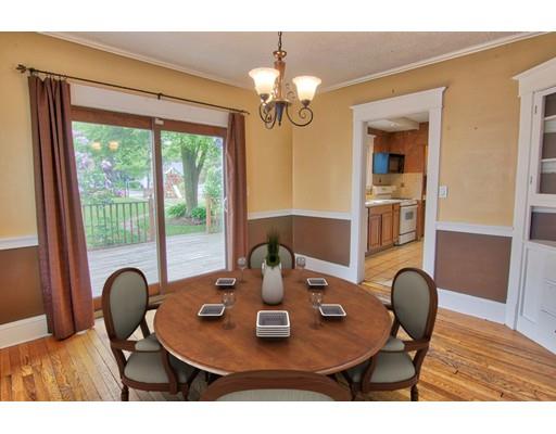 141 Dwight Road Springfield, MA 01108 - Photo 5 of 12 a view of a dining room with furniture a chandelier and wooden floor