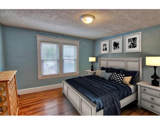 141 Dwight Road Springfield, MA 01108 - Photo 7 of 12 a bedroom with a bed and a lamp