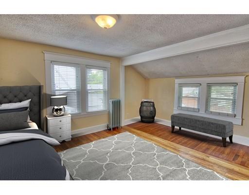 141 Dwight Road Springfield, MA 01108 - Photo 8 of 12 a bedroom with a bed and wooden floor