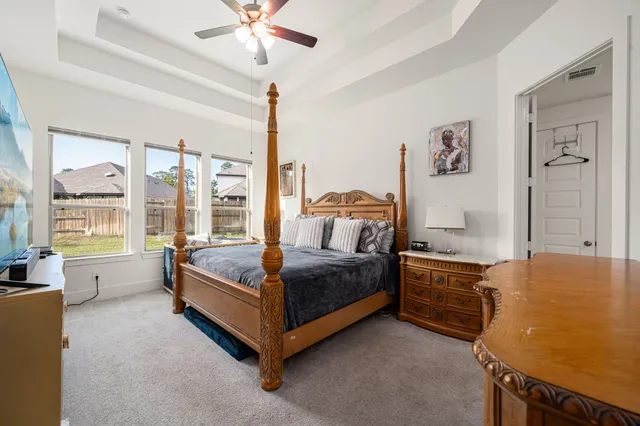 a bedroom with a bed and a table