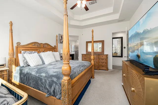 a bed room with a bed and dresser