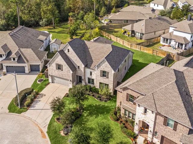 an aerial view of a house with a ocean view