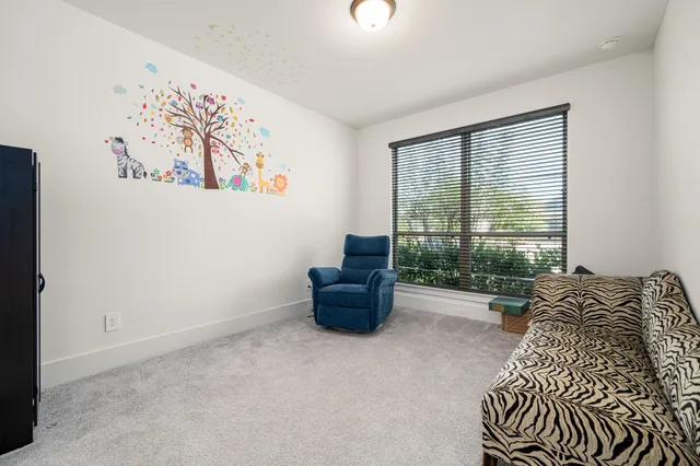 a bed room with furniture and a window