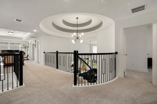 a view interior of a house with stairs and a floor to ceiling window
