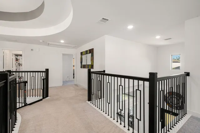 a view of a hallway with windows