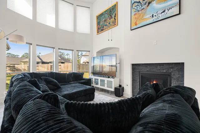 a living room with furniture and a fireplace