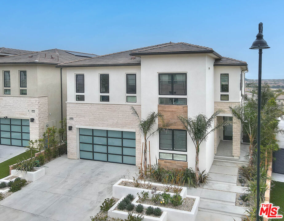 20558 Overlook Court Porter Ranch, CA 91326 - Photo 45 of 48 a front view of a house with a garden