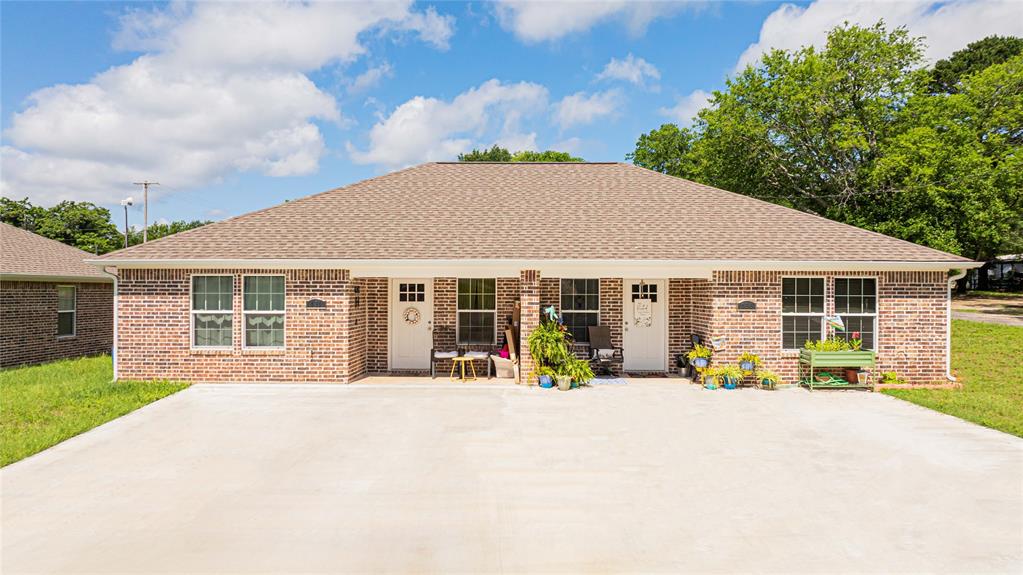 105 Francis Street Hawkins, TX 75765 - Photo 1 of 15 a view of a house with sitting area and garden