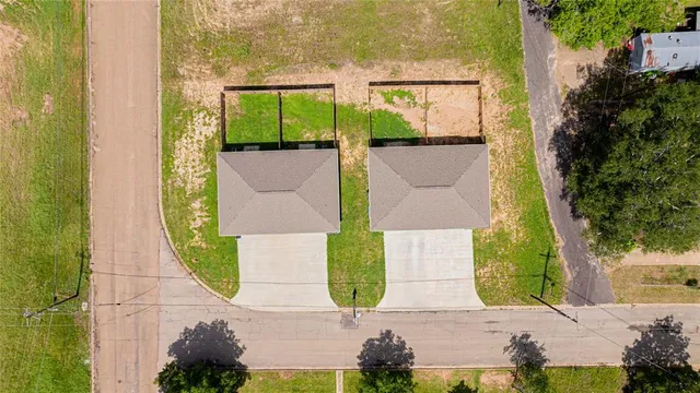 an aerial view of a house with swimming pool