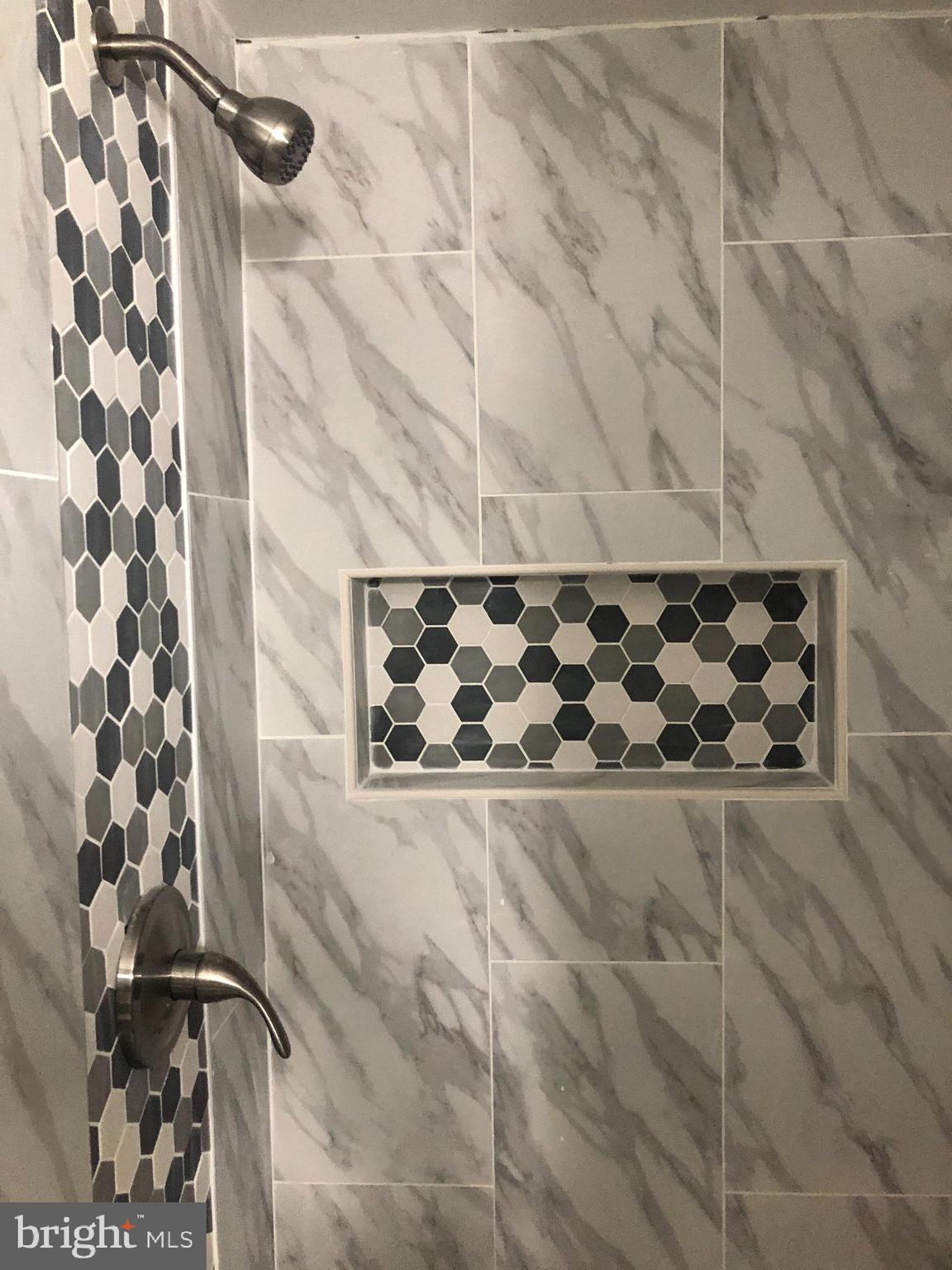 7441 Edsworth Road Baltimore, MD 21222 - Photo 29 of 37 a bathroom with a bathtub and shower