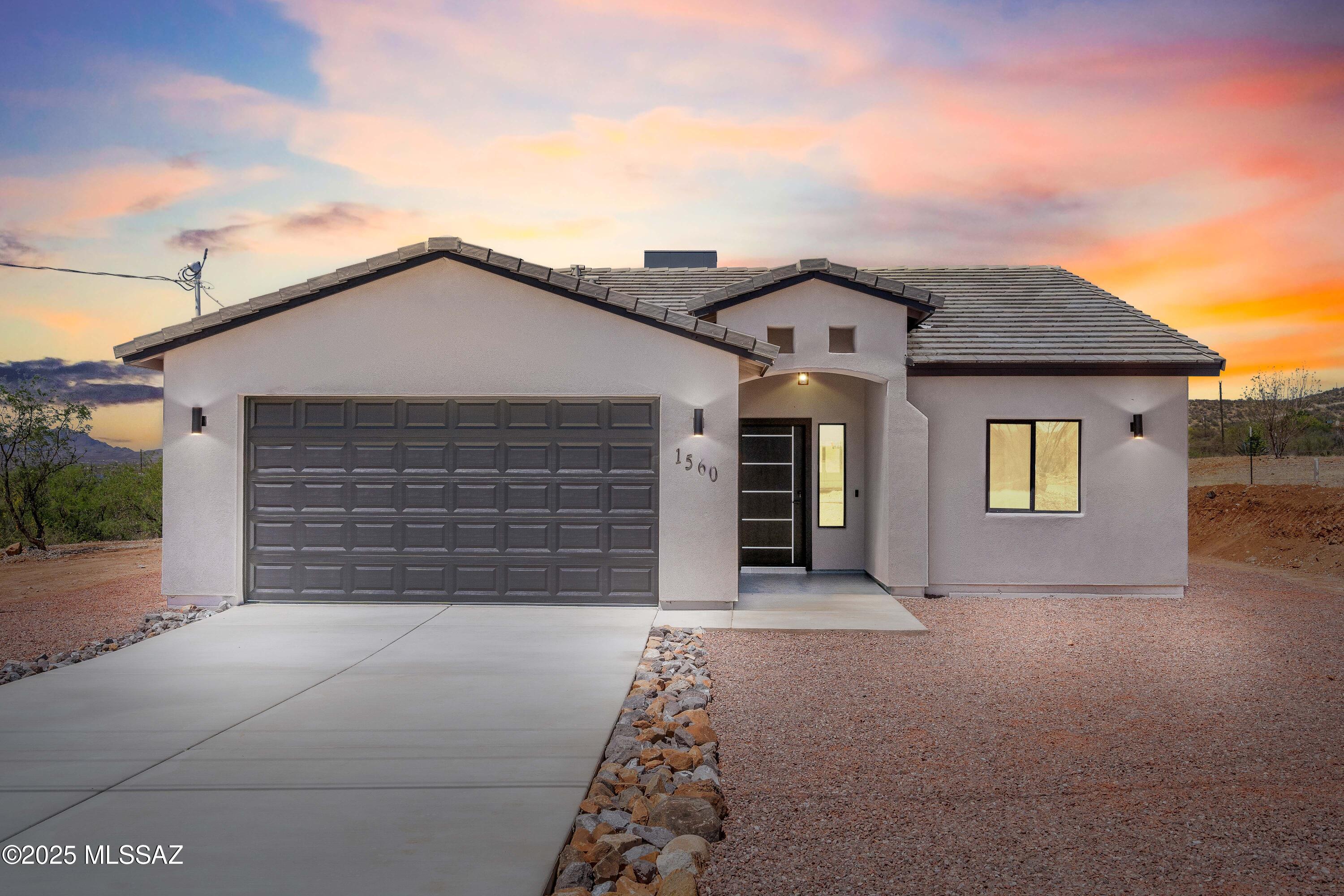 1560 Pinguinos Court Rio Rico, AZ 85648 - Photo 2 of 33 front view of a house with a large window