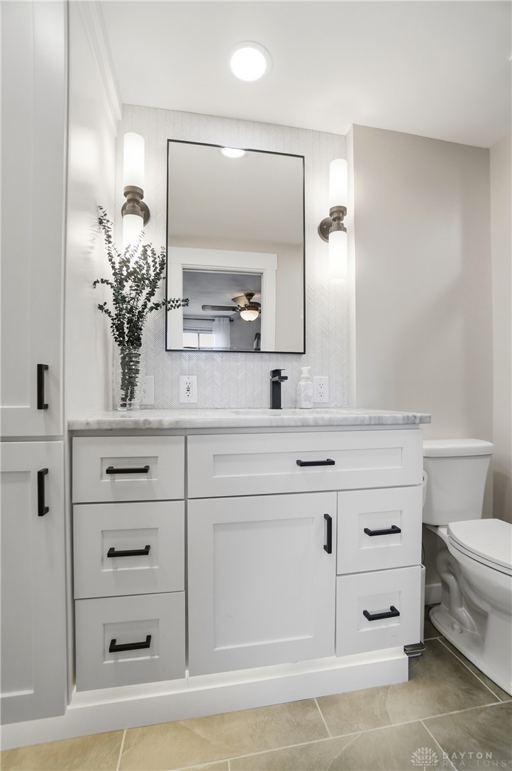 2848 Ellen Lane Dayton, OH 45430 - Photo 33 of 62 This bright bathroom features ample storage and modern fixtures, creating a clean and functional space.